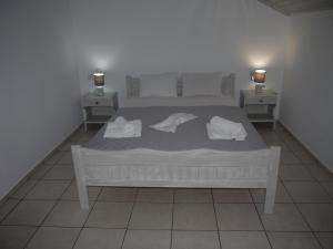 Posteľ alebo postele v izbe v ubytovaní Hotel Akropolis