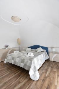 A bed or beds in a room at Casa la Perla