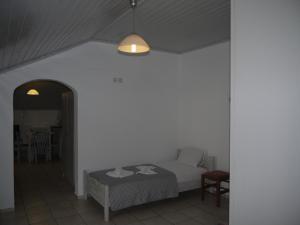 Posteľ alebo postele v izbe v ubytovaní Hotel Akropolis