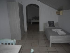 Posteľ alebo postele v izbe v ubytovaní Hotel Akropolis