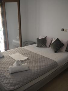 Posteľ alebo postele v izbe v ubytovaní Hotel Akropolis