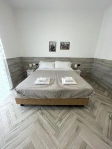 Letto o letti in una camera di Holiday Rooms Rho