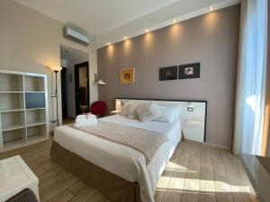a bedroom with a large bed in a room at Ma&Mi For You B&B in Cefalù
