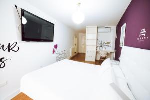 Postel nebo postele na pokoji v ubytování Hostal Pozo