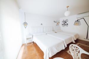 Postel nebo postele na pokoji v ubytování Hostal Pozo