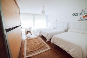 Postel nebo postele na pokoji v ubytování Hostal Pozo