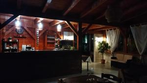 a dining area of a restaurant with a bar at Affitta Camere "Le Quercigliole" in Ripalimosani