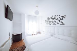 Posteľ alebo postele v izbe v ubytovaní Hostal Misericordia