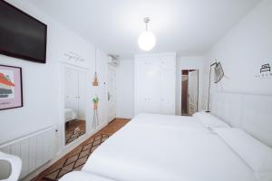Posteľ alebo postele v izbe v ubytovaní Hostal Misericordia + 9 fotografií
