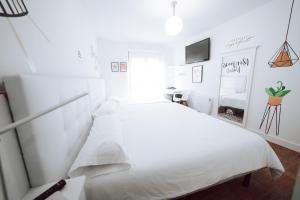 Posteľ alebo postele v izbe v ubytovaní Hostal Misericordia