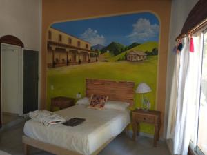 A bed or beds in a room at Hacienda Jaqueline