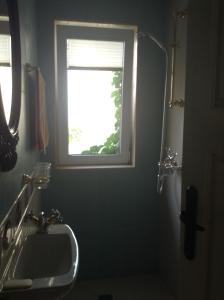 a bathroom with a sink and a window at Hostel Del Mar in Varna City +20 photos