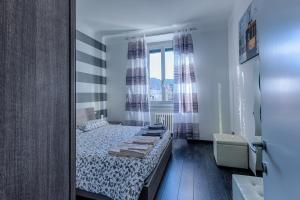 Postel nebo postele na pokoji v ubytování Casa Vacanze Macchi
