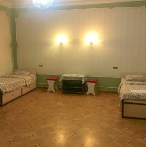 Postel nebo postele na pokoji v ubytování Royal Boutique Hotel on Kievyan