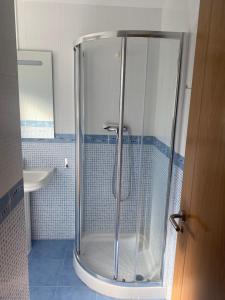 a shower with a glass door in a bathroom at Posada H.El Alba in Boó de Piélagos +35 photos
