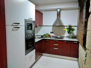 Kuchyň nebo kuchyňský kout v ubytování Moderno y acogedor apartamento en el casco histórico + 19 fotografií