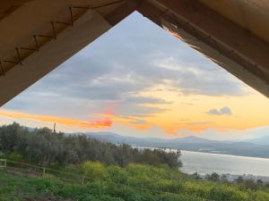 a view of a sunset from a bridge at Sky Glamping boutique in Moshav Ramot