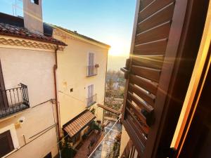 a view of a balcony from a window of a building at Pacentro Dimora del Castello in Pacentro