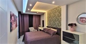 Katil atau katil-katil dalam bilik di Art City Luxury Residence in the Center of Alanya