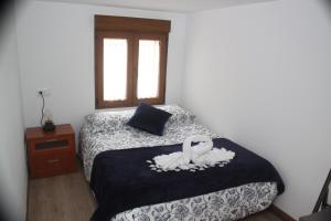 A bed or beds in a room at Casita La Glorieta
