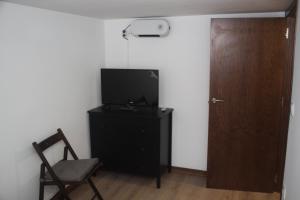 A television and/or entertainment centre at Casita La Glorieta