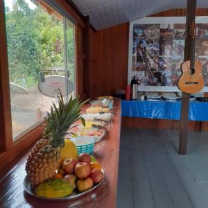 a buffet of food on a table with fruit on it at Amazon Boto Lodge Hotel in Careiro