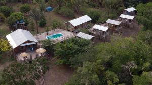 an aerial view of a house with a swimming pool at Amazon Boto Lodge Hotel in Careiro