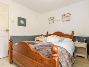 Ένα ή περισσότερα κρεβάτια σε δωμάτιο στο Little Beach House