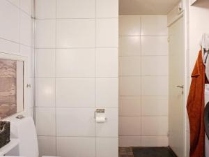 a white bathroom with a toilet and a shower at 4 person holiday home in SLITE in Slite +30 photos
