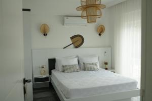 Кровать или кровати в номере Blue Island Luxury Hotel Adults Only