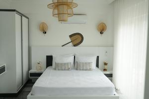 Кровать или кровати в номере Blue Island Luxury Hotel Adults Only