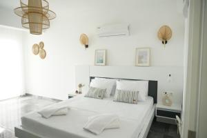 Кровать или кровати в номере Blue Island Luxury Hotel Adults Only