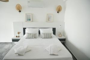 Кровать или кровати в номере Blue Island Luxury Hotel Adults Only