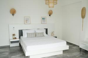 Кровать или кровати в номере Blue Island Luxury Hotel Adults Only