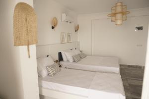 Кровать или кровати в номере Blue Island Luxury Hotel Adults Only