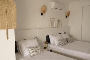 Кровать или кровати в номере Blue Island Luxury Hotel Adults Only
