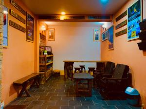 a room with chairs and a table in a room at Naman Boutique Home in Pokhara