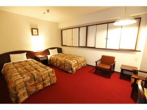 En eller flere senger på et rom på Tokyo Inn - Vacation STAY 11131v