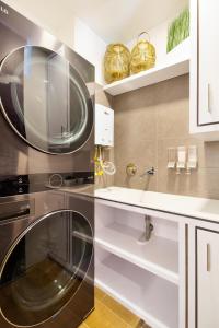 a kitchen with a microwave and a sink at Energy 801 in Medellín +29 photos