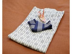 a white napkin with a blue and white striped tie at Tokyo Inn - Vacation STAY 10227v in Tokyo
