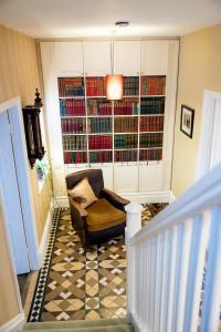 a living room with a chair and a large window at Newgate House in Barnard Castle