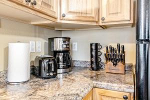 a kitchen with a counter top with a coffee maker at Bungalow on Boyd in Coeur d'Alene