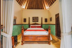 Postel nebo postele na pokoji v ubytování Bebek Cottages Sanur