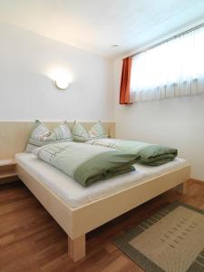 En eller flere senge i et værelse på Almhaus Nassfeld