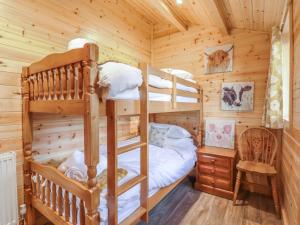Ένα ή περισσότερα κρεβάτια σε δωμάτιο στο Buttercup Lodge