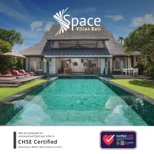 a house with a pool and a swimming pool at Space Villas Bali in Seminyak