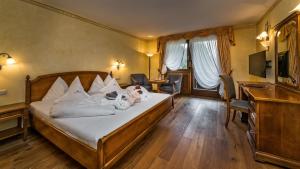 Posteľ alebo postele v izbe v ubytovaní Romantik Hotel Santer