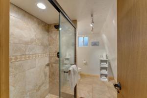 a bathroom with a shower with a glass door at Hillside Cabin~Williams & Grand Canyon Destination in Williams +15 photos