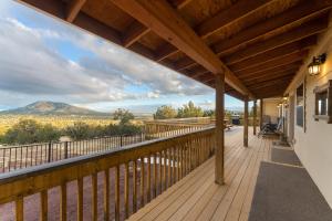 a deck with a view of a mountain at Hillside Cabin~Williams & Grand Canyon Destination in Williams