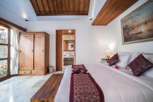 Postel nebo postele na pokoji v ubytování Gigimas Private Villa + 12 fotografií